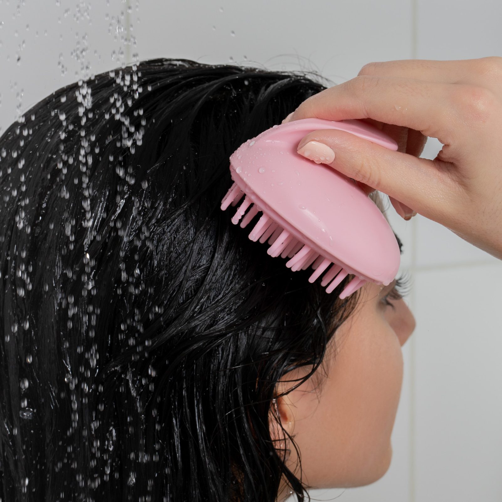 Brushworks Scalp Massaging Brush being used in the shower